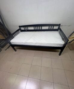 The image appears to show a dark black wooden daybed, featuring rails on three sides and a standard double size with a white mattress. - Image 7