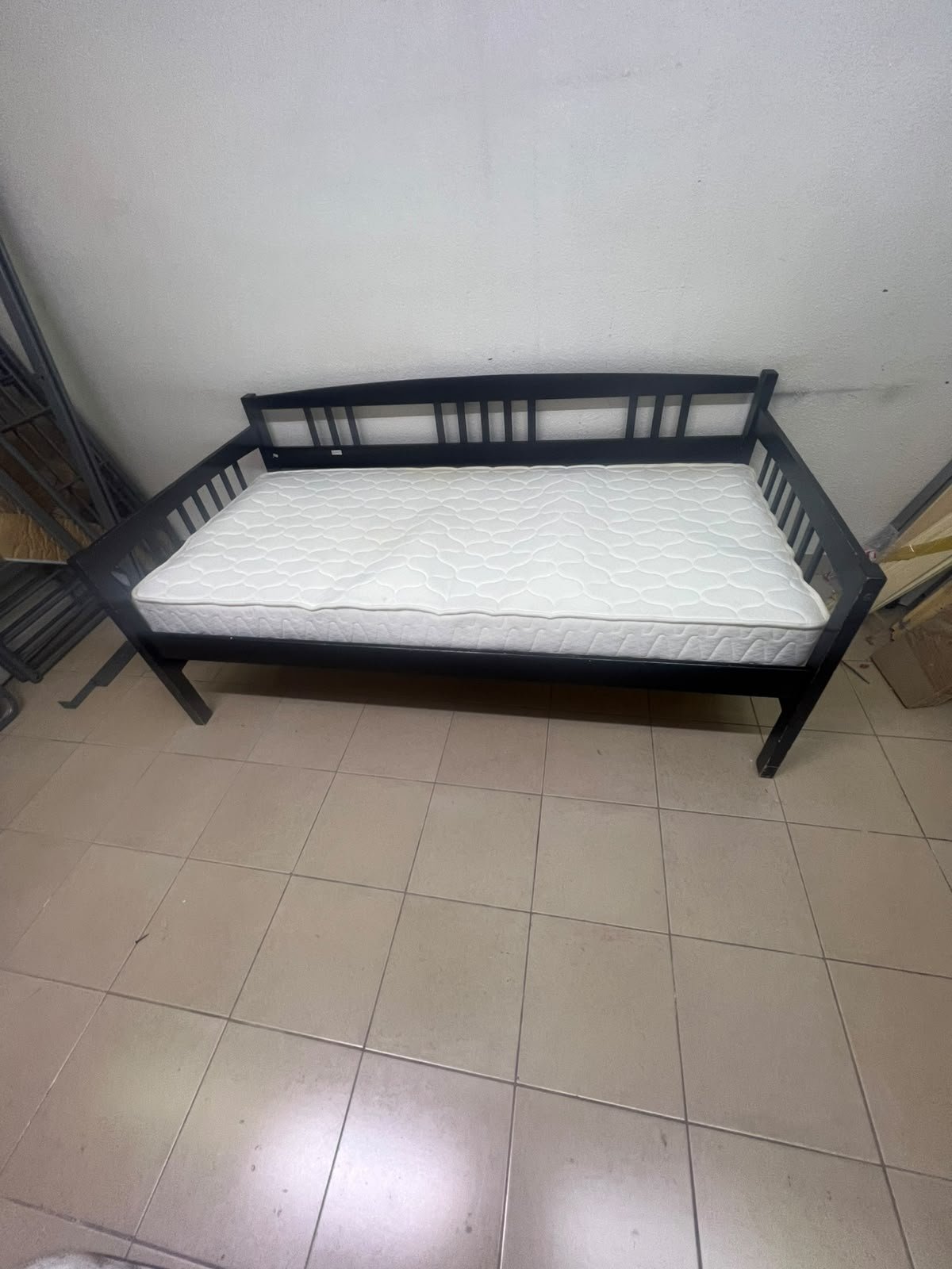 The image appears to show a dark black wooden daybed, featuring rails on three sides and a standard double size with a white mattress. - Image 7