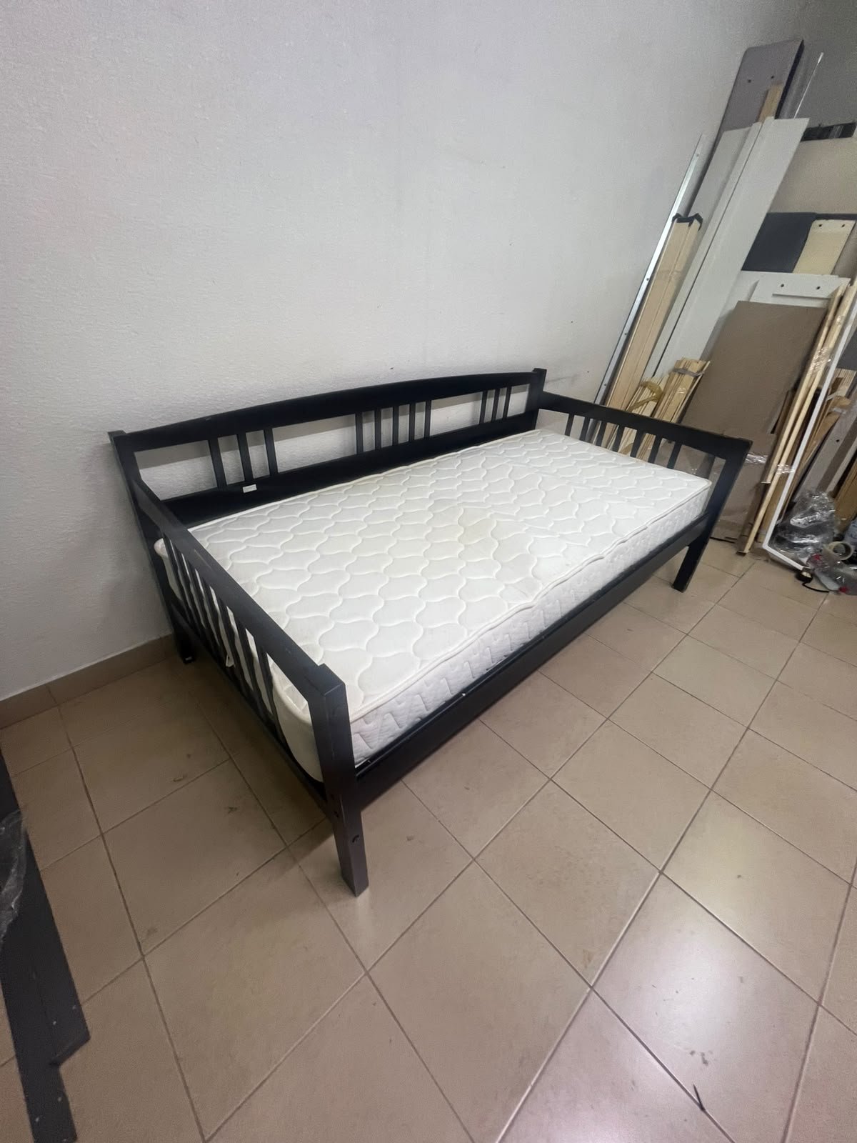 The image appears to show a dark black wooden daybed, featuring rails on three sides and a standard double size with a white mattress. - Image 6