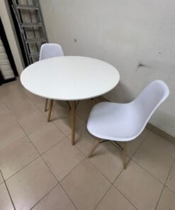 A modern Scandinavian-style round white dining table with wooden legs, accompanied by two matching white chairs. - Image 8