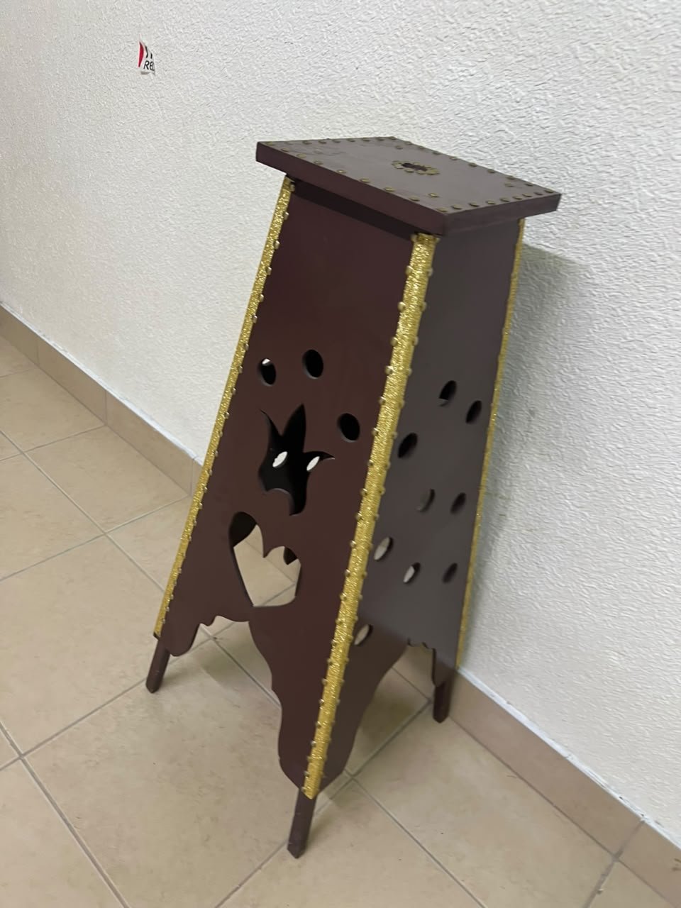 A tall wooden garment incense burner (incense stand) featuring a tower or pyramid design; it is used to scent abayas, clothing, and fabrics by hanging or placing them over the burner, allowing them to absorb the fragrance of incense and oud. - Image 4