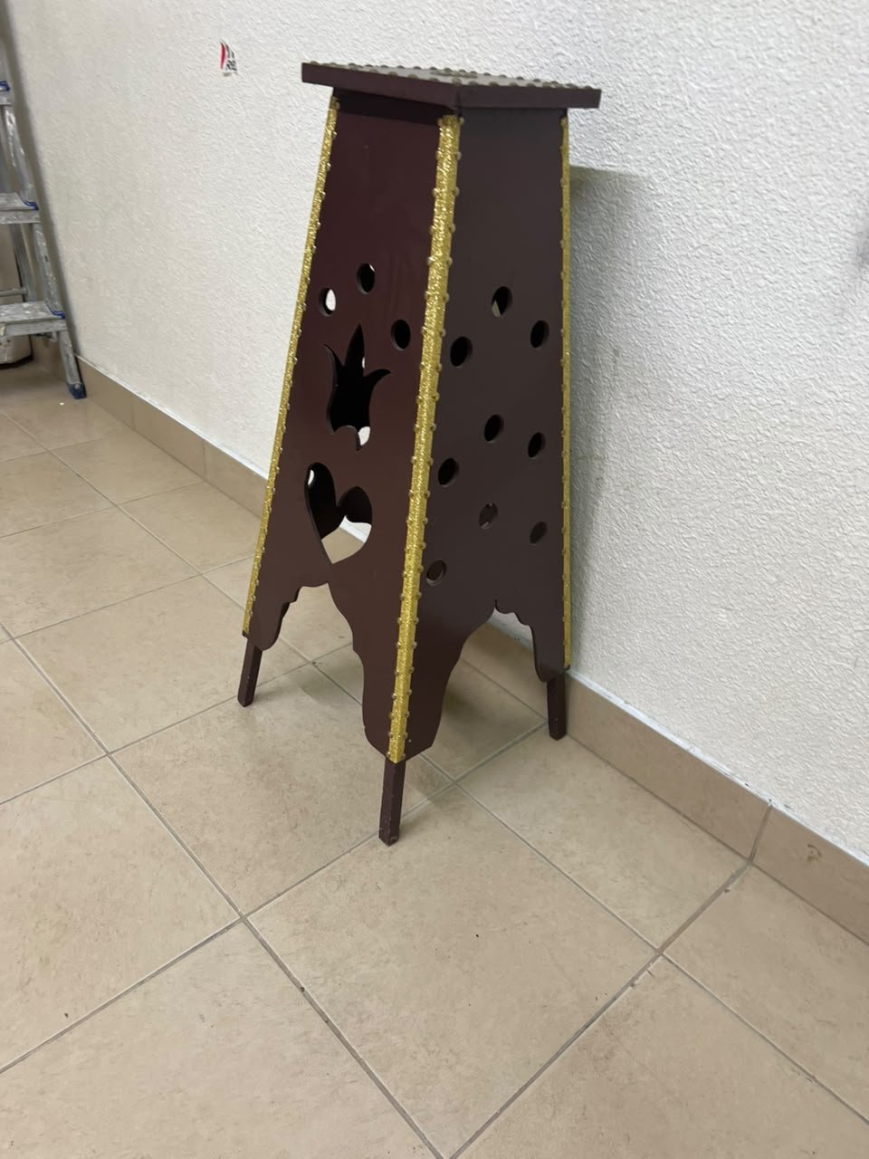 A tall wooden garment incense burner (incense stand) featuring a tower or pyramid design; it is used to scent abayas, clothing, and fabrics by hanging or placing them over the burner, allowing them to absorb the fragrance of incense and oud. - Image 5