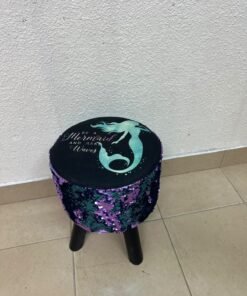 This product is a small decorative stool featuring a "mermaid" sequin design—with reversible sequins that change color—and sturdy black wooden legs. - Image 4