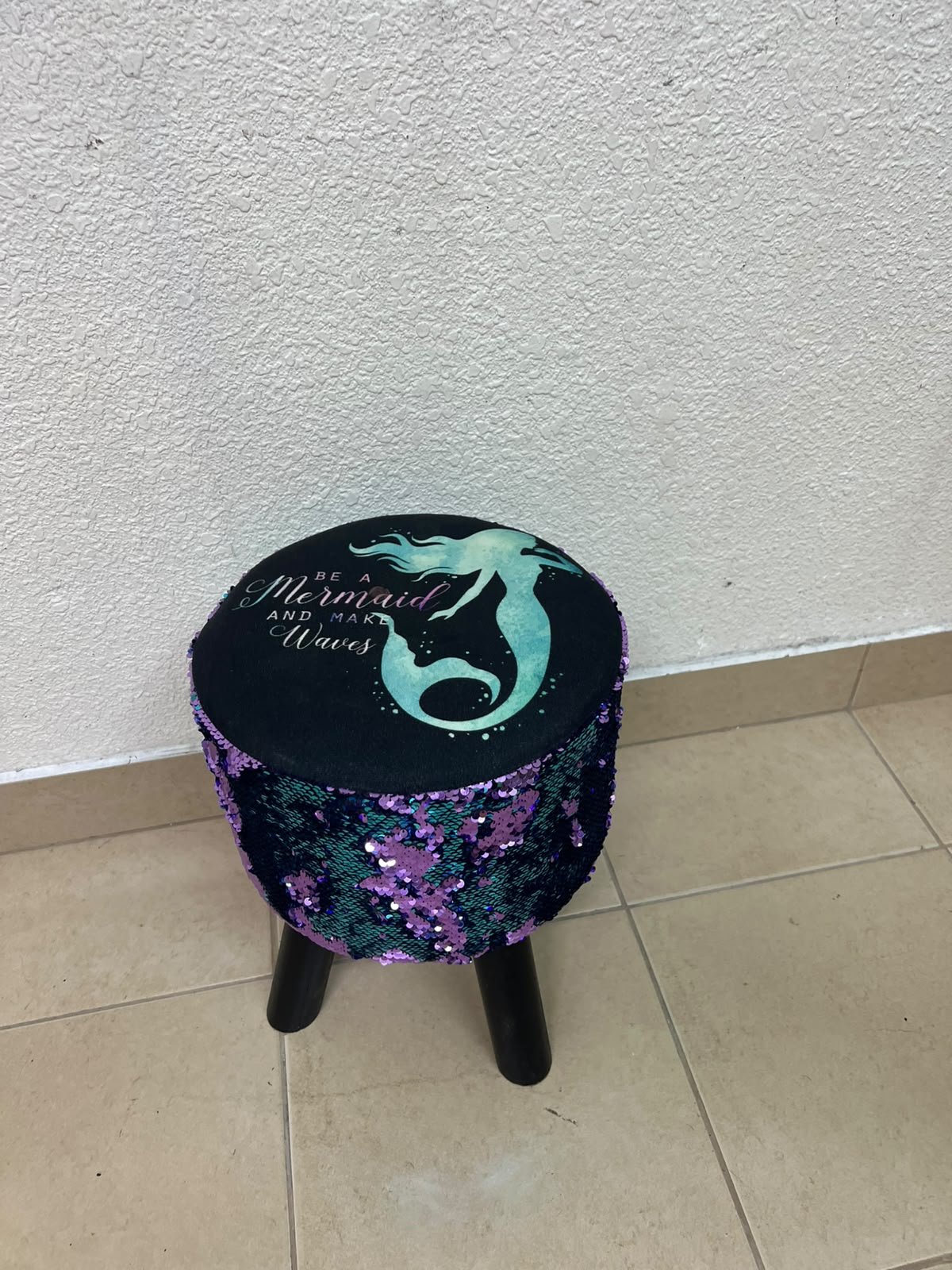 This product is a small decorative stool featuring a "mermaid" sequin design—with reversible sequins that change color—and sturdy black wooden legs. - Image 4