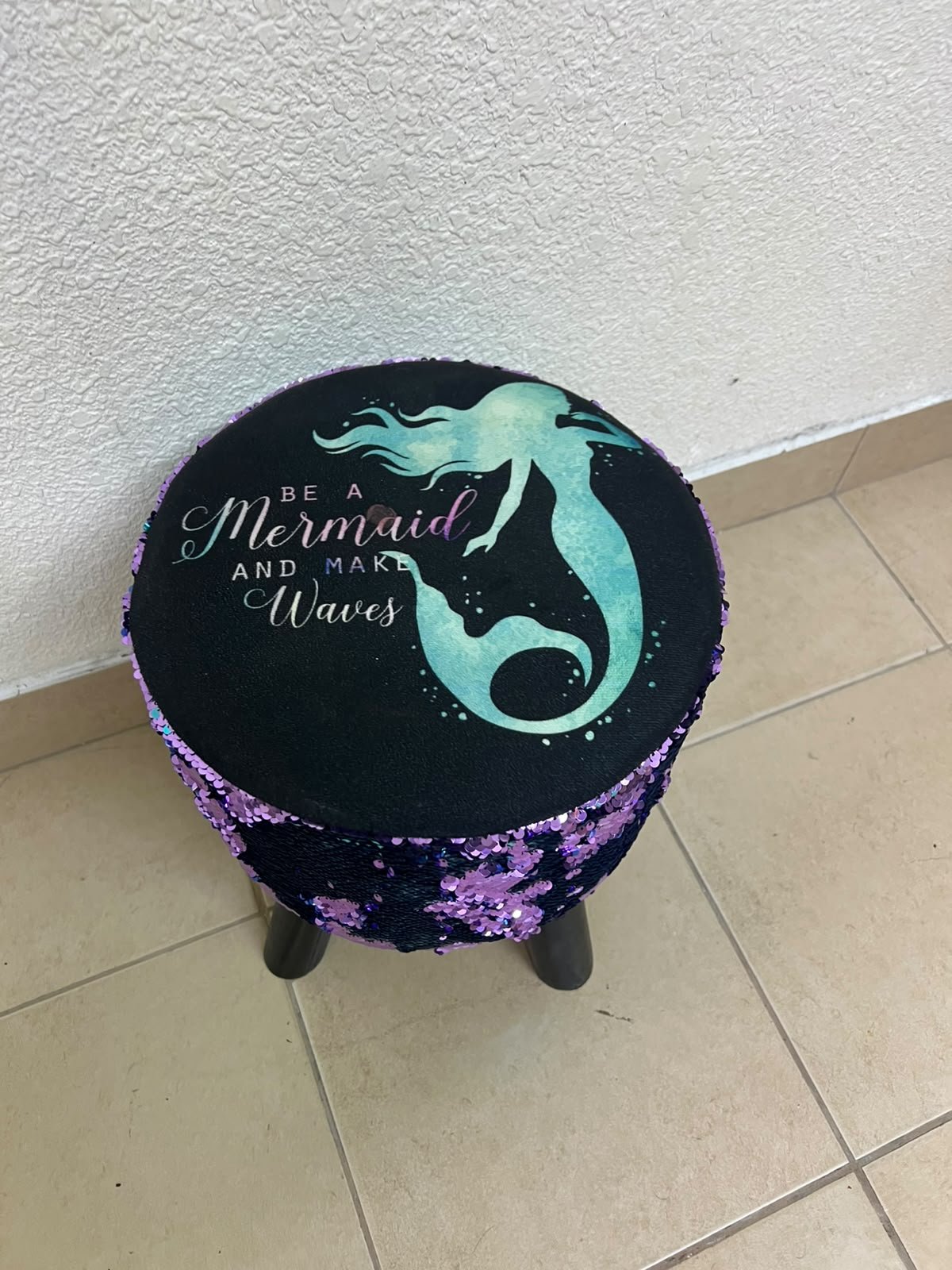 This product is a small decorative stool featuring a "mermaid" sequin design—with reversible sequins that change color—and sturdy black wooden legs. - Image 6