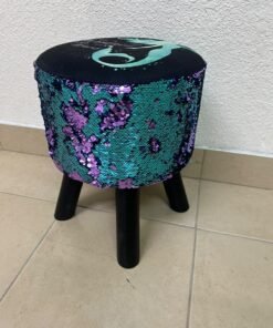 This product is a small decorative stool featuring a "mermaid" sequin design—with reversible sequins that change color—and sturdy black wooden legs.