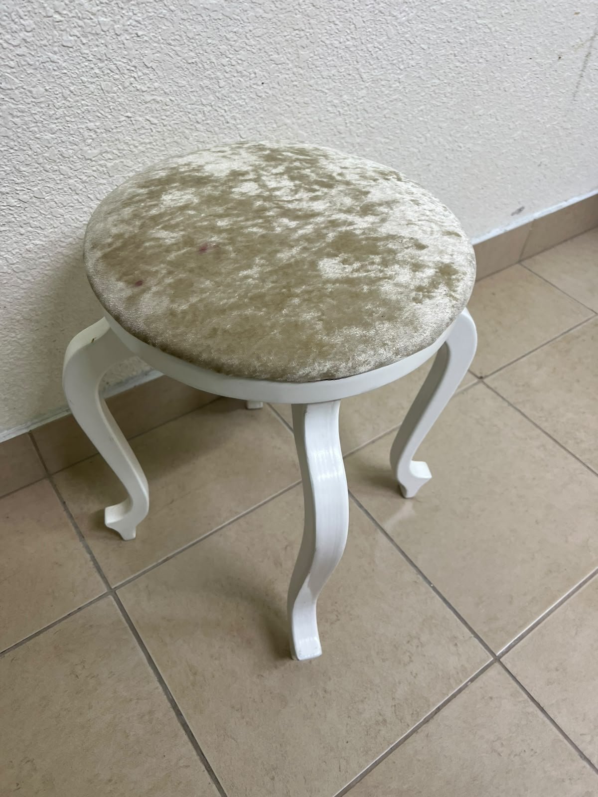 A vanity stool featuring a classic French or "Queen Anne" design, characterized by a white wooden frame with cabriole legs and a round seat upholstered in beige or light-gold velvet fabric. - Image 3