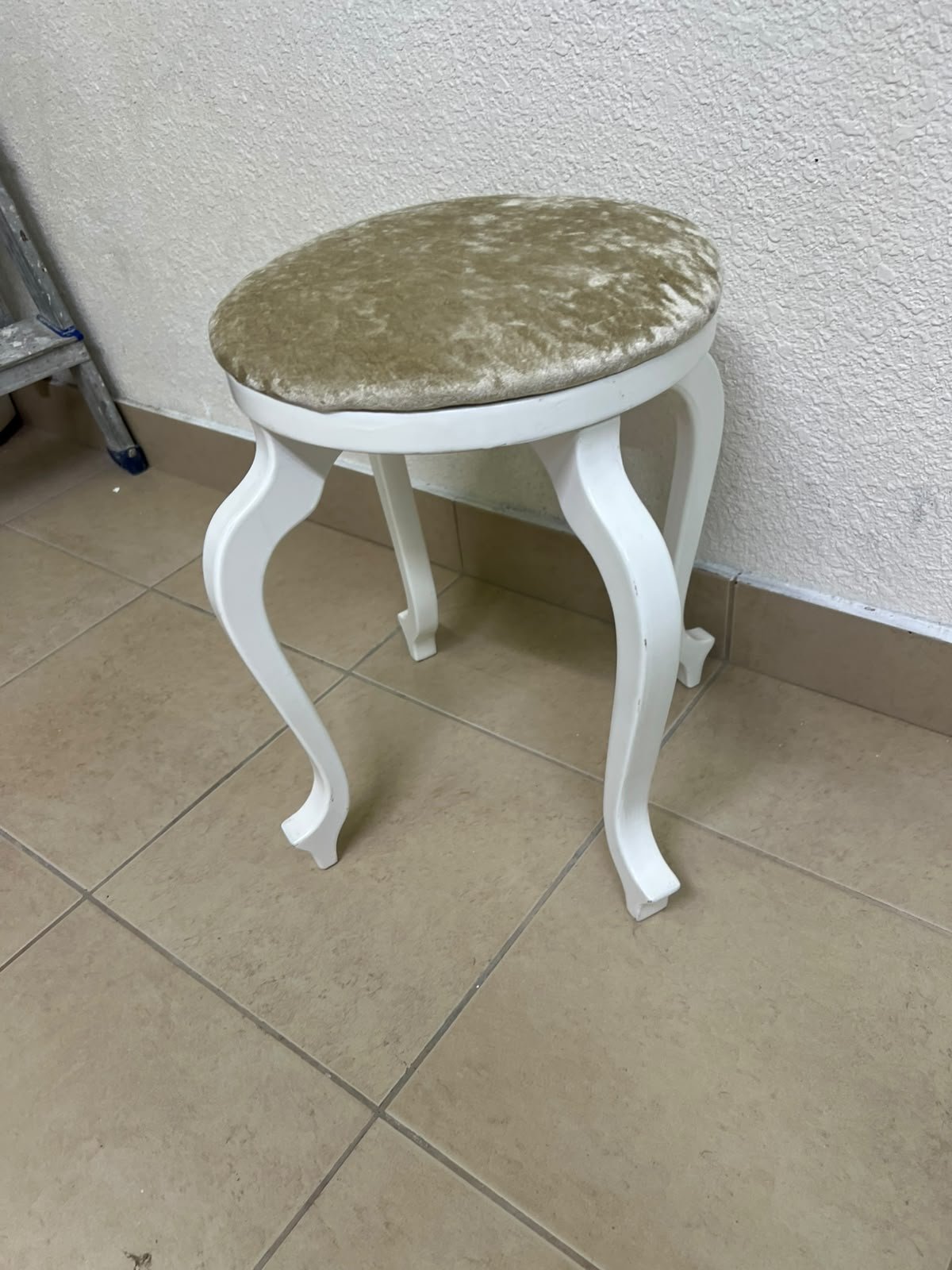 A vanity stool featuring a classic French or "Queen Anne" design, characterized by a white wooden frame with cabriole legs and a round seat upholstered in beige or light-gold velvet fabric. - Image 11