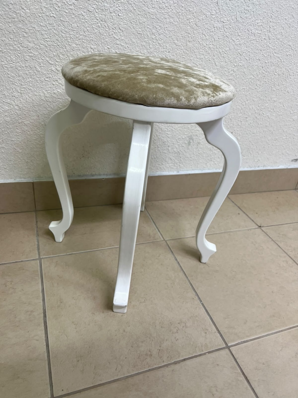 A vanity stool featuring a classic French or "Queen Anne" design, characterized by a white wooden frame with cabriole legs and a round seat upholstered in beige or light-gold velvet fabric. - Image 12