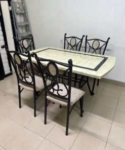 A dining table featuring a metal design with a decorative top and a set of matching upholstered chairs; it appears suitable for home use or a functional office setting. - Image 13