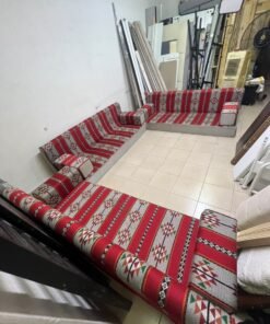 A traditional U-shaped floor seating set (Arabic *majlis*), upholstered in fabric featuring red, heritage-inspired Sadu patterns. - Image 9