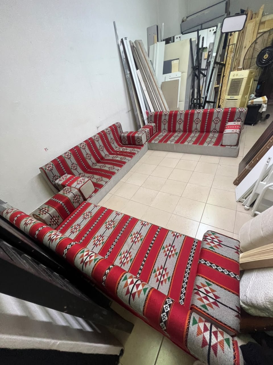 A traditional U-shaped floor seating set (Arabic *majlis*), upholstered in fabric featuring red, heritage-inspired Sadu patterns. - Image 9