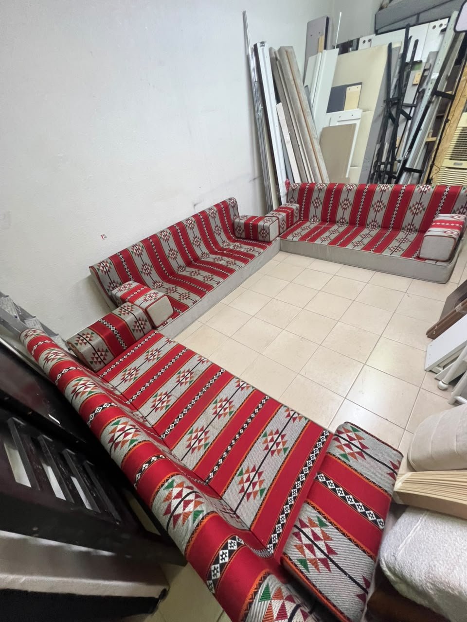 A traditional U-shaped floor seating set (Arabic *majlis*), upholstered in fabric featuring red, heritage-inspired Sadu patterns. - Image 5