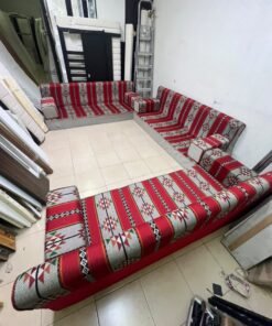 A traditional U-shaped floor seating set (Arabic *majlis*), upholstered in fabric featuring red, heritage-inspired Sadu patterns. - Image 8