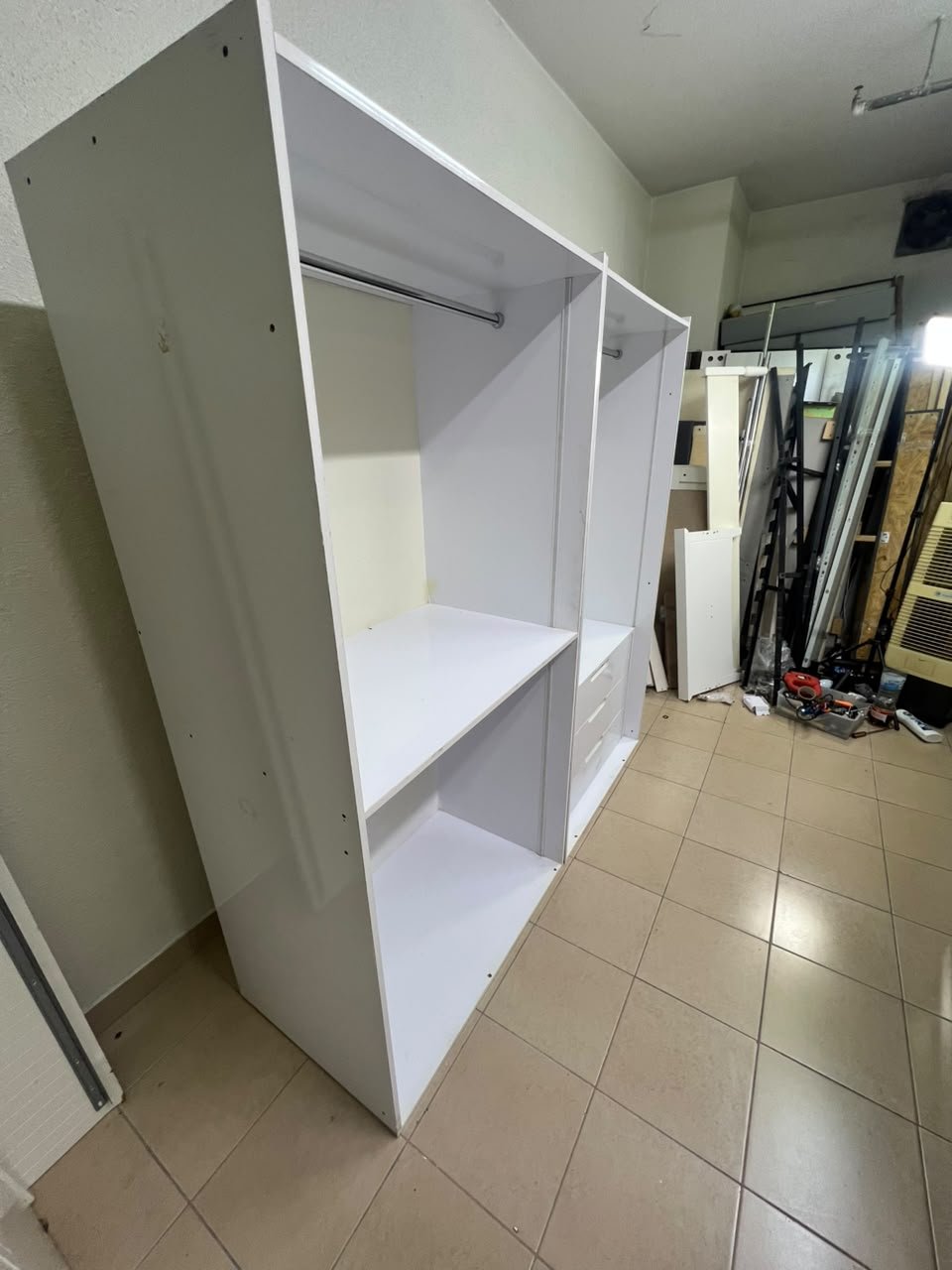 A white open wardrobe unit made of MDF, featuring shelves, drawers, and a clothes rail. - Image 7