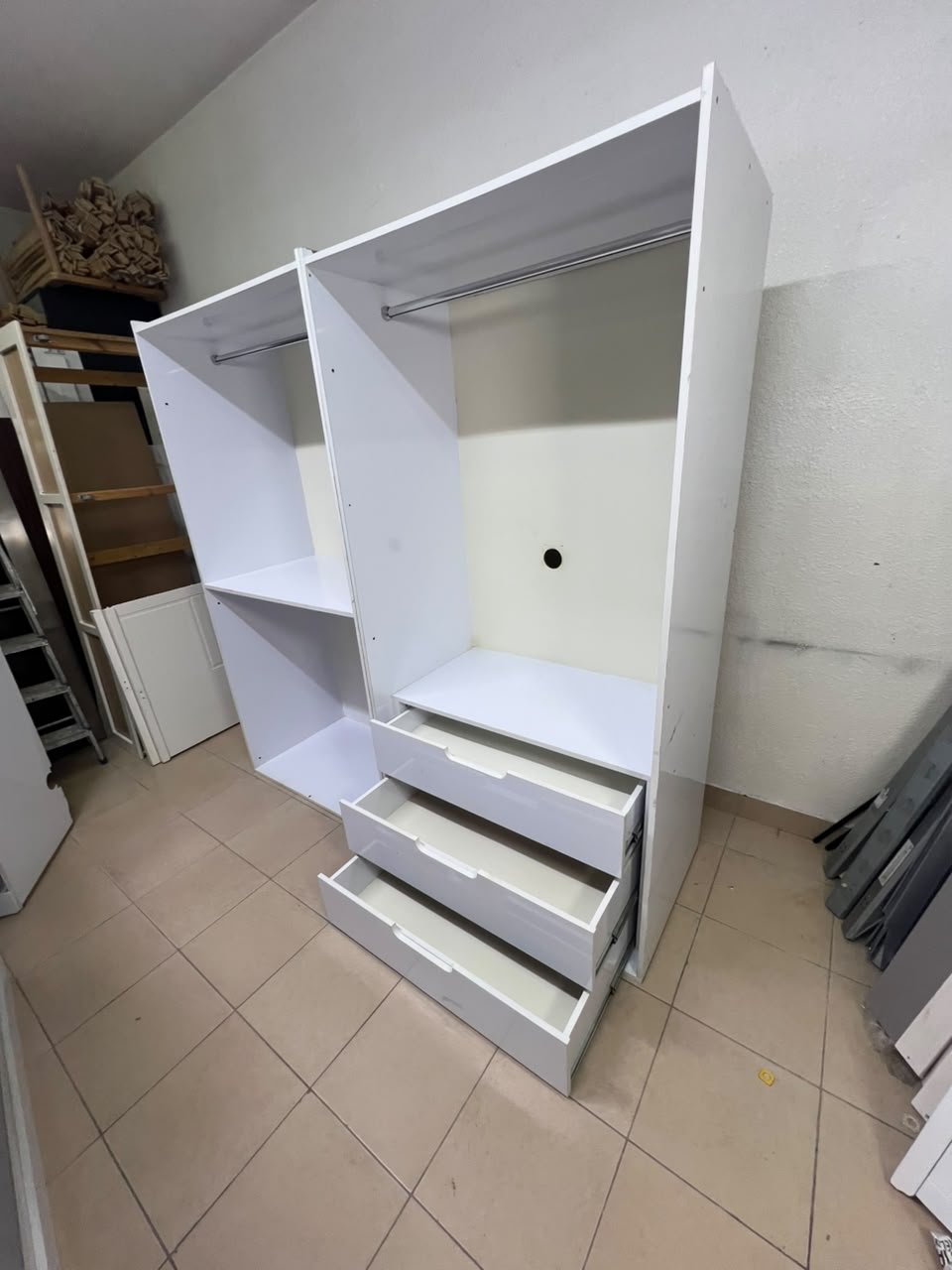 A white open wardrobe unit made of MDF, featuring shelves, drawers, and a clothes rail. - Image 6
