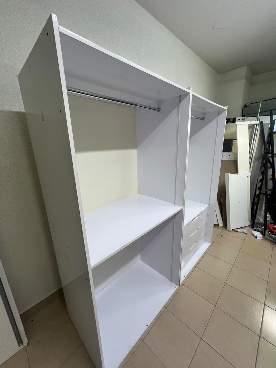 A white open wardrobe unit made of MDF, featuring shelves, drawers, and a clothes rail. - Image 4