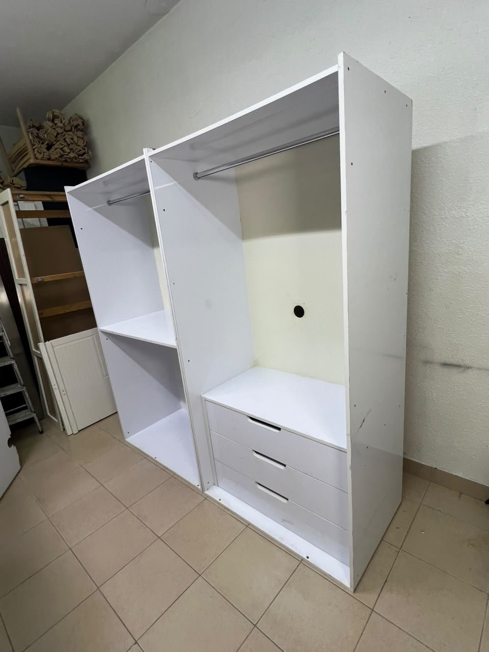 A white open wardrobe unit made of MDF, featuring shelves, drawers, and a clothes rail. - Image 3