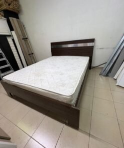 A dark brown wooden double bed featuring a headboard accented with a silver metal strip, and equipped with a white padded mattress. - Image 2