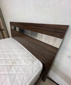 A dark brown wooden double bed featuring a headboard accented with a silver metal strip, and equipped with a white padded mattress. - Image 3
