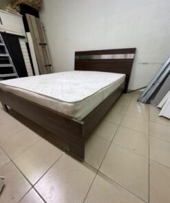A dark brown wooden double bed featuring a headboard accented with a silver metal strip, and equipped with a white padded mattress. - Image 4