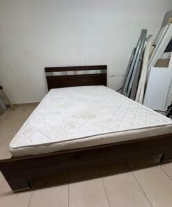 A dark brown wooden double bed featuring a headboard accented with a silver metal strip, and equipped with a white padded mattress. - Image 10