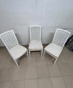 A set of white wooden chairs featuring a woven-mesh backrest design and white seat covers. - Image 3
