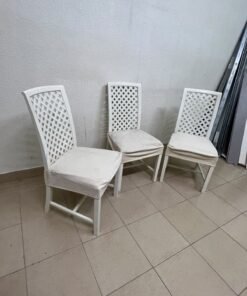 A set of white wooden chairs featuring a woven-mesh backrest design and white seat covers. - Image 4