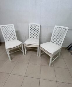 A set of white wooden chairs featuring a woven-mesh backrest design and white seat covers. - Image 6