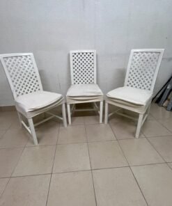 A set of white wooden chairs featuring a woven-mesh backrest design and white seat covers. - Image 7