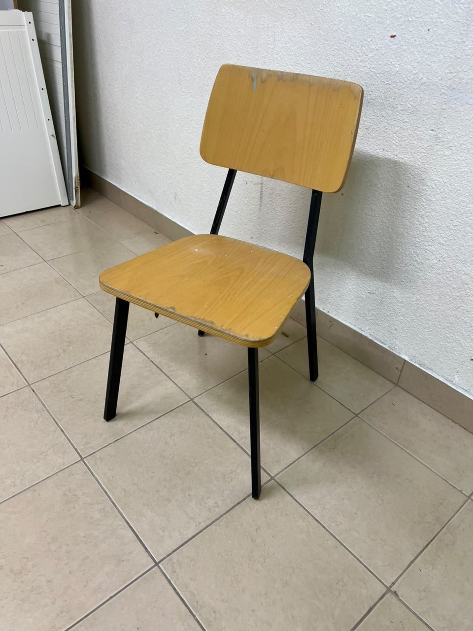 Classic school chair featuring a plywood seat and backrest, and a black metal frame. - Image 2