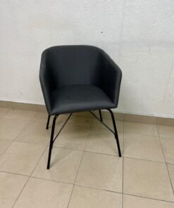 The chair shown in the picture looks similar to the TOSSBERG model from IKEA, made of dark gray fabric with black metal legs. - Image 7
