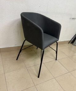 The chair shown in the picture looks similar to the TOSSBERG model from IKEA, made of dark gray fabric with black metal legs. - Image 2