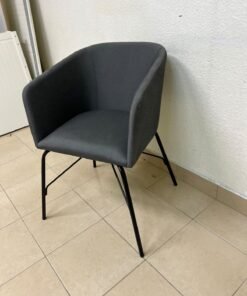 The chair shown in the picture looks similar to the TOSSBERG model from IKEA, made of dark gray fabric with black metal legs. - Image 3