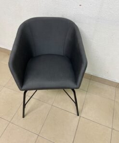 The chair shown in the picture looks similar to the TOSSBERG model from IKEA, made of dark gray fabric with black metal legs. - Image 4