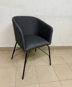 The chair shown in the picture looks similar to the TOSSBERG model from IKEA, made of dark gray fabric with black metal legs.