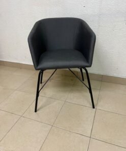 The chair shown in the picture looks similar to the TOSSBERG model from IKEA, made of dark gray fabric with black metal legs. - Image 5
