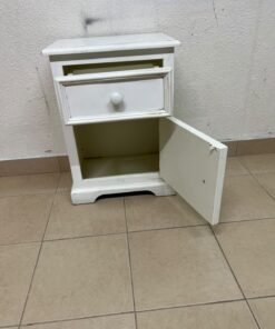 A white side table or nightstand featuring a traditional, classic design, comprising an upper drawer and a lower cabinet with a door, both fitted with round wooden knobs. - Image 2