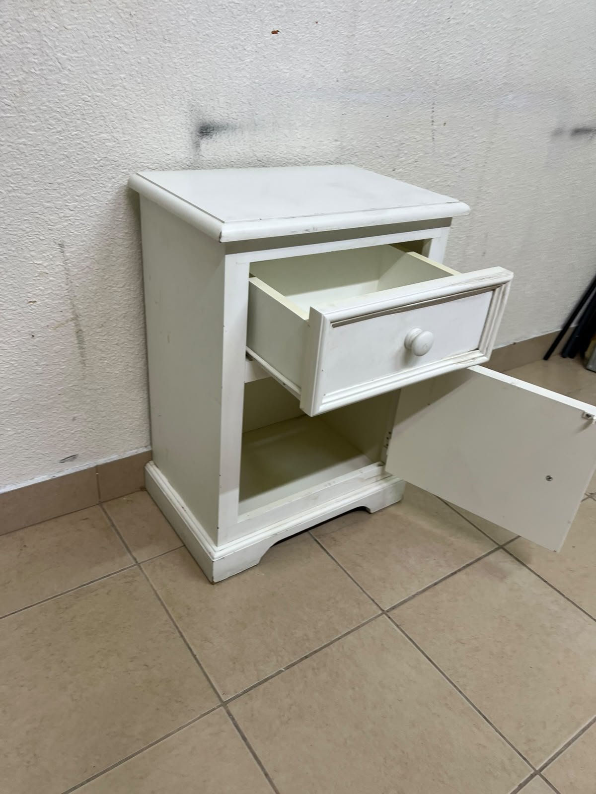 A white side table or nightstand featuring a traditional, classic design, comprising an upper drawer and a lower cabinet with a door, both fitted with round wooden knobs. - Image 5
