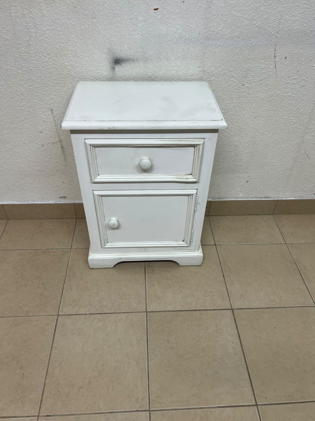 A white side table or nightstand featuring a traditional, classic design, comprising an upper drawer and a lower cabinet with a door, both fitted with round wooden knobs. - Image 13