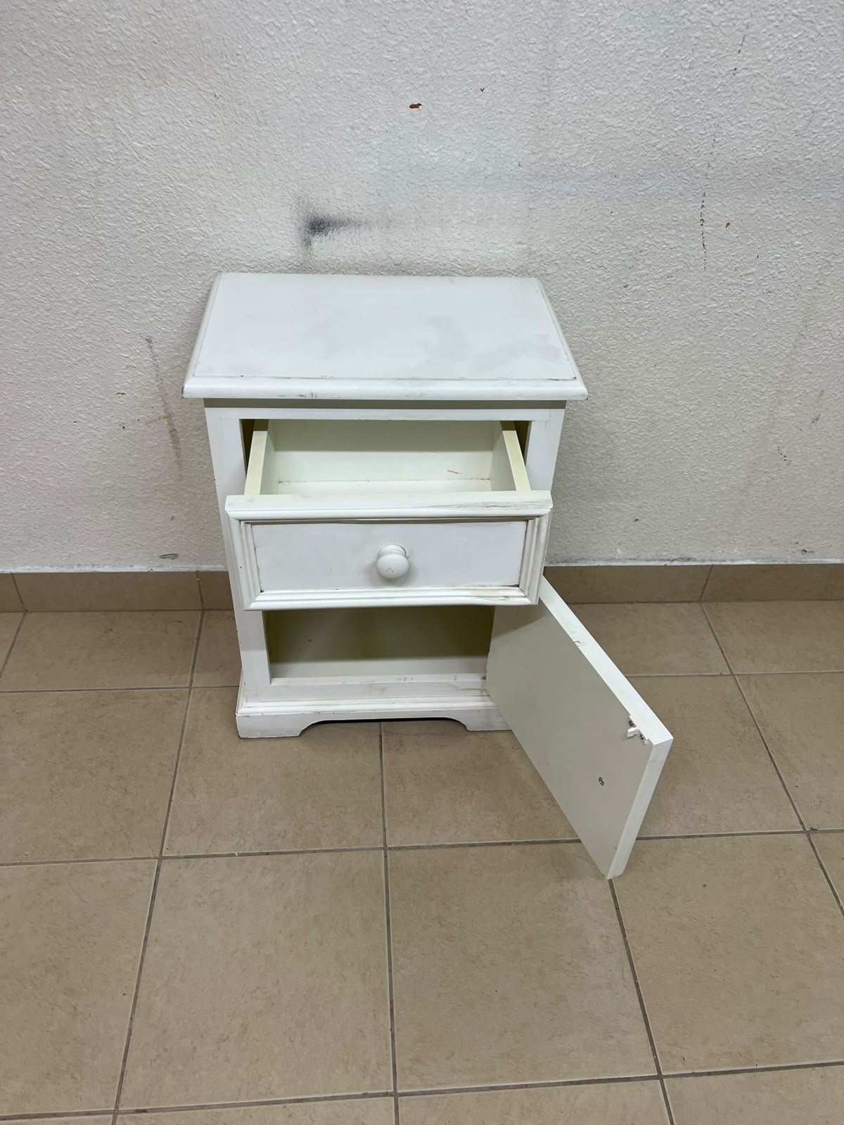 A white side table or nightstand featuring a traditional, classic design, comprising an upper drawer and a lower cabinet with a door, both fitted with round wooden knobs. - Image 6