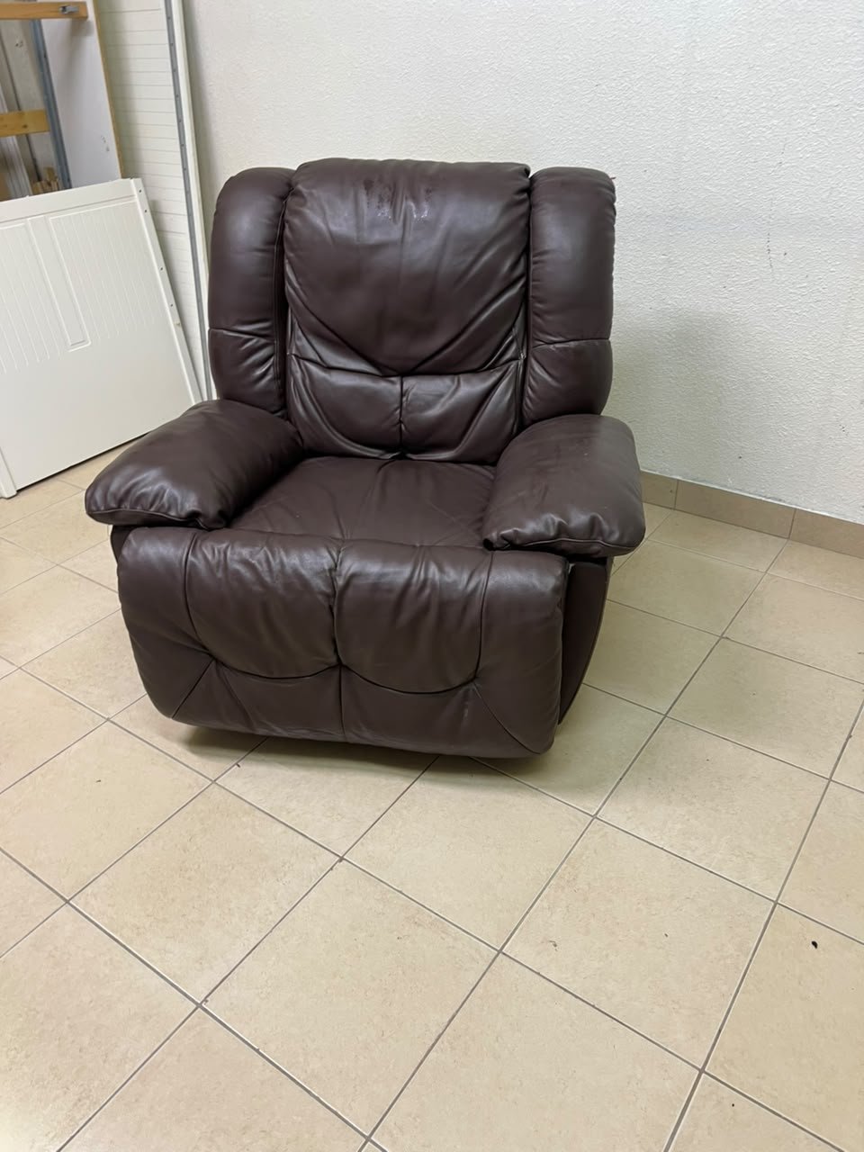 A brown faux leather single recliner featuring padded armrests and backrest, and a manual side handle for position control. - Image 11