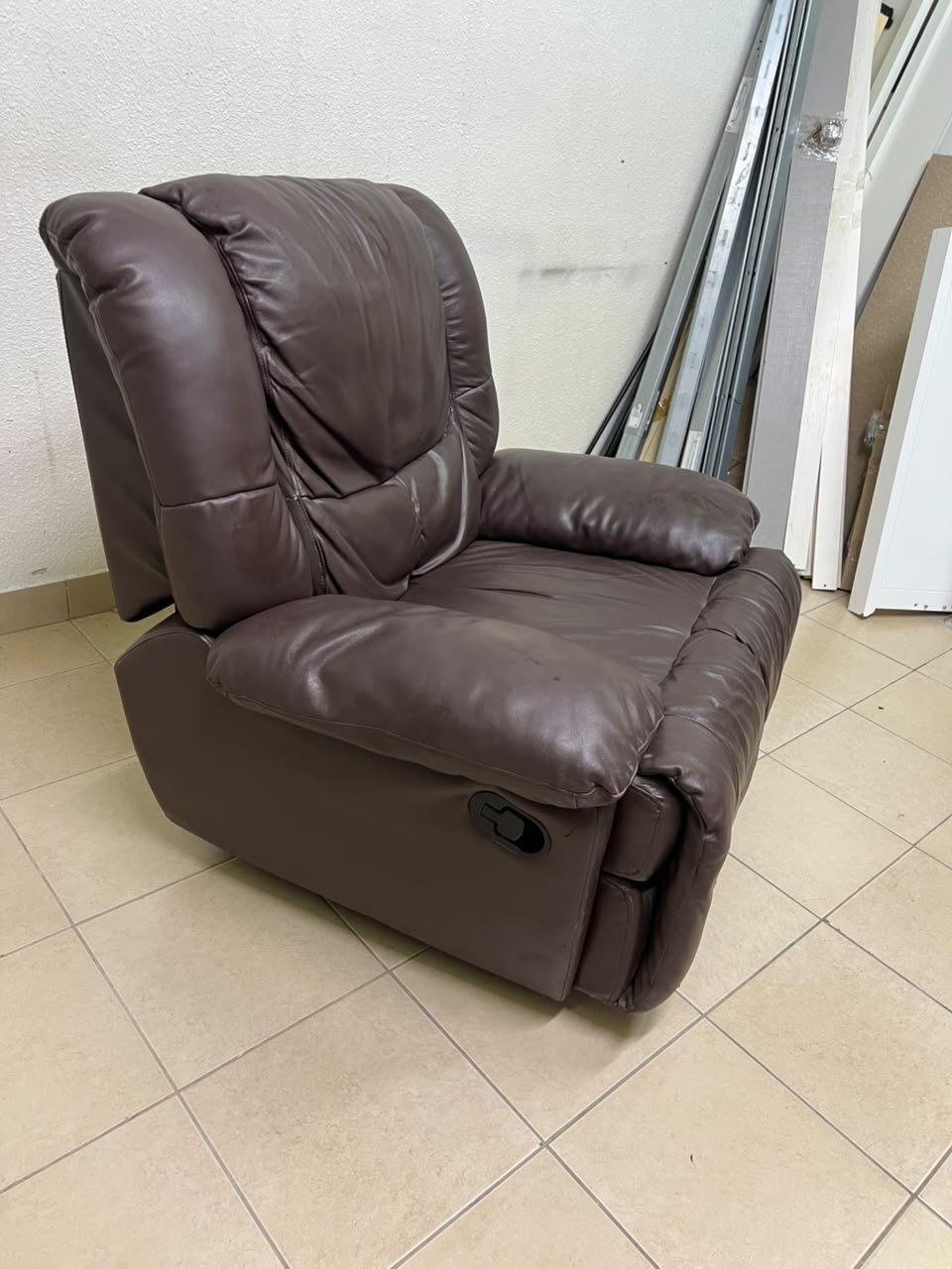 A brown faux leather single recliner featuring padded armrests and backrest, and a manual side handle for position control. - Image 10