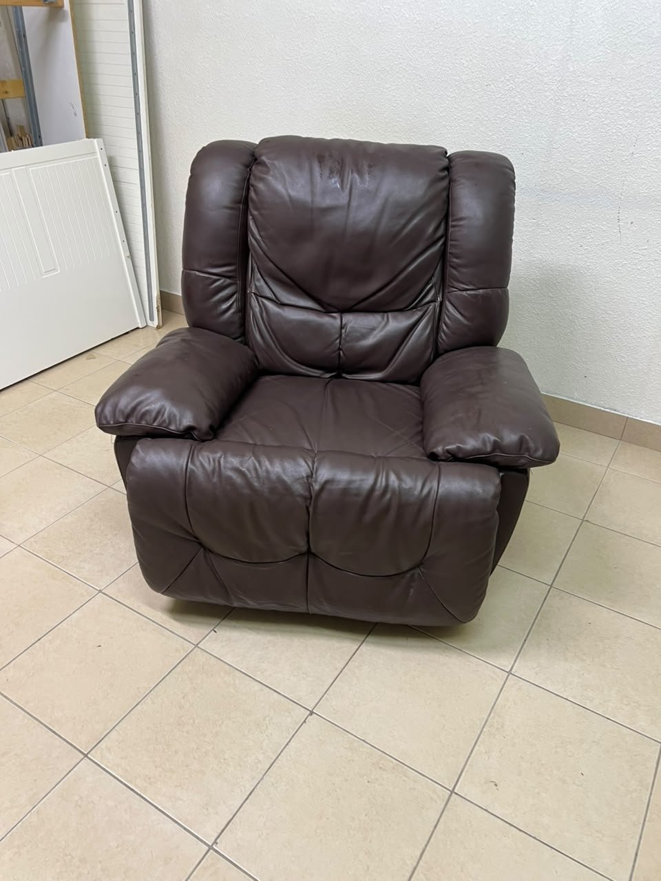 A brown faux leather single recliner featuring padded armrests and backrest, and a manual side handle for position control. - Image 8
