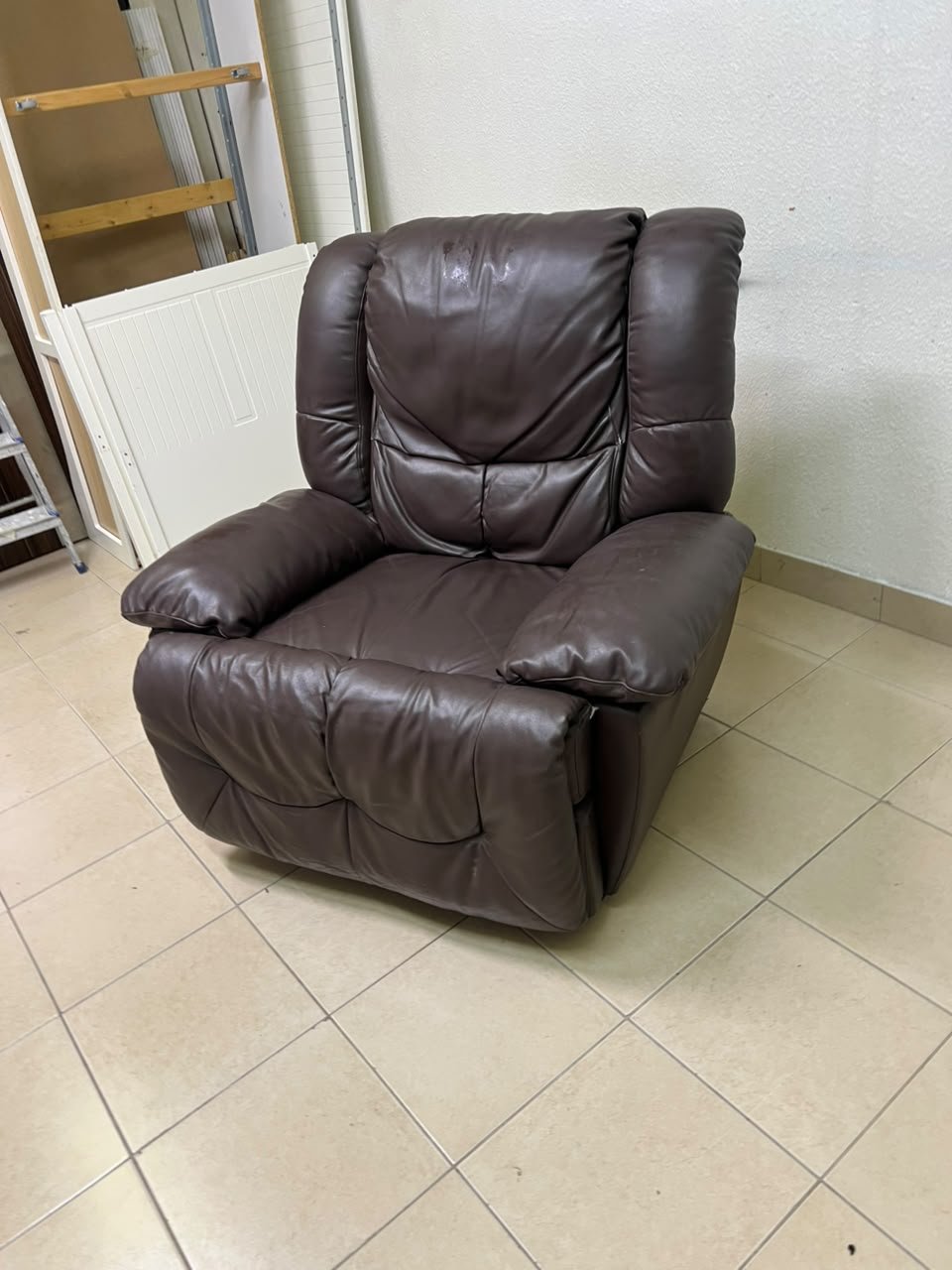 A brown faux leather single recliner featuring padded armrests and backrest, and a manual side handle for position control. - Image 7
