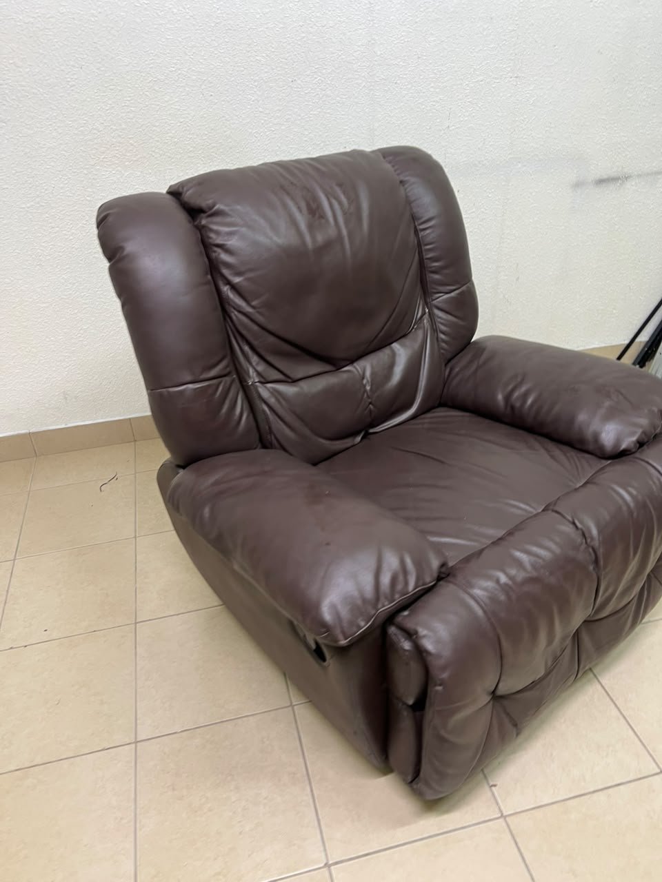 A brown faux leather single recliner featuring padded armrests and backrest, and a manual side handle for position control. - Image 4