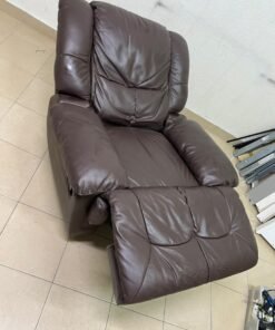 A brown faux leather single recliner featuring padded armrests and backrest, and a manual side handle for position control. - Image 3
