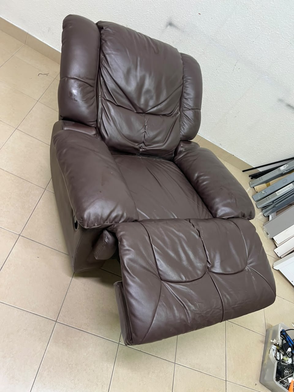 A brown faux leather single recliner featuring padded armrests and backrest, and a manual side handle for position control. - Image 3