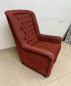 A classic-style armchair featuring a high, button-tufted backrest, upholstered in textured dark red fabric, and accented with metal nailhead trim along the edges. - Image 4