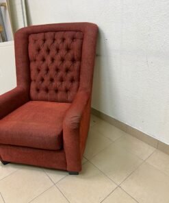 A classic-style armchair featuring a high, button-tufted backrest, upholstered in textured dark red fabric, and accented with metal nailhead trim along the edges. - Image 6